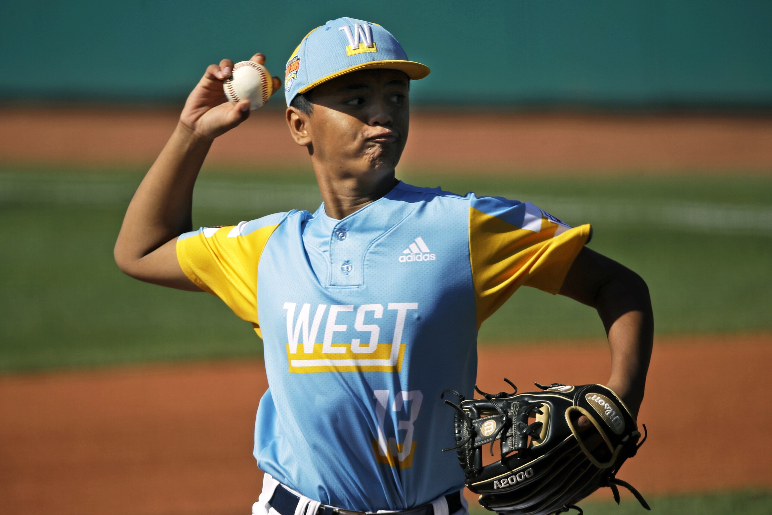 Wailuku, Hawaii's Shiloh Gilliland (13) delivers a pitch against Japan in the first inning of the Consolation baseball game at the Little League World Series tournament in South Williamsport, Pa., Sunday, Aug. 25, 2019. Japan won the game 5-0. (AP Photo/Tom E. Puskar)