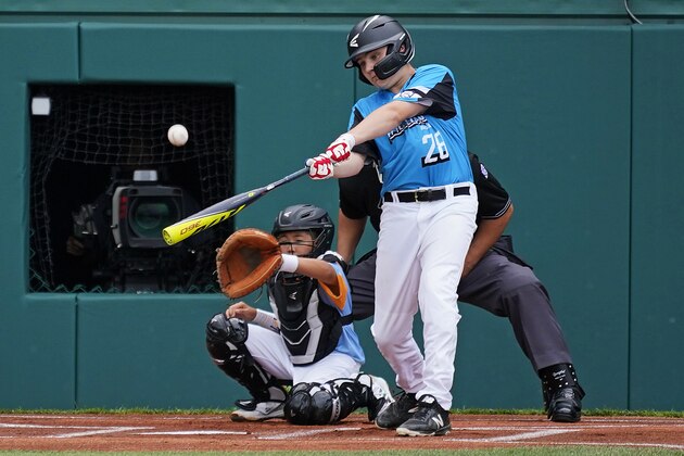 Manchester, Connecticut's Arlen Peyman (28) hits a solo home run off Honolulu, Hawaii's Ryan Keanu during the first inning of a baseball game at the Little League World Series tournament in South Williamsport, Pa., Thursday, Aug. 19, 2021. (AP Photo/Gene J. Puskar)