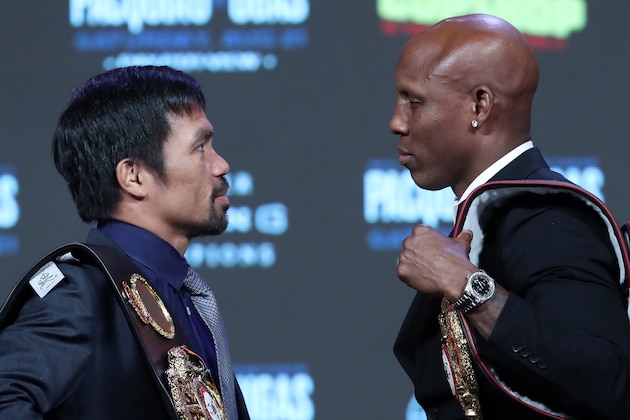 LAS VEGAS, NEVADA - AUGUST 18: Manny Pacquiao (L) and WBA welterweight champion Yordenis Ugas face off during a news conference at MGM Grand Garden Arena on August 18, 2021 in Las Vegas, Nevada. Pacquiao will challenge Ugas for his title at T-Mobile Arena on August 21 in Las Vegas. (Photo by Steve Marcus/Getty Images)