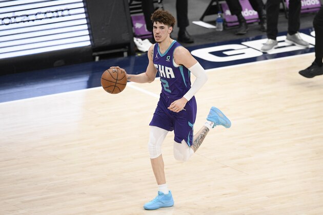 Charlotte Hornets guard LaMelo Ball (2) dribbles the ball during the second half of an NBA basketball game against the Washington Wizards, Sunday, May 16, 2021, in Washington. (AP Photo/Nick Wass)