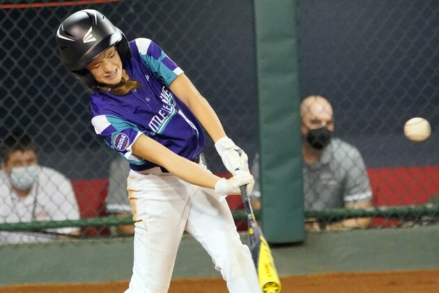 Abilene, Texas' Ella Bruning (8) connects for an RBI-single against Sammamish, Wash., during the sixth inning of a baseball game at the Little League World Series in South Williamsport, Pa., Friday, Aug. 20, 2021. (AP Photo/Tom E. Puskar)
