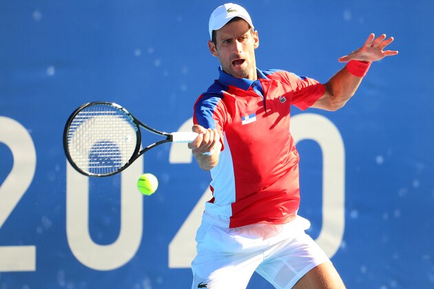 TOKYO, JAPAN - JULY 31: Novak Djokovic of Team Serbia hits a forehand against Pablo Carreno Busta of Team Spain during the Men's Singles Bronze Medal Match on day eight of the Tokyo 2020 Olympic Games at Ariake Tennis Park on July 31, 2021 in Tokyo, Japan. (Photo by Abbie Parr/Getty Images)
