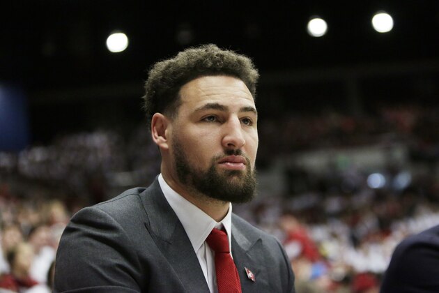 Golden State Warriors and former Washington State guard Klay Thompson looks on during the first half of an NCAA college basketball game between Washington State and Oregon State in Pullman, Wash., Saturday, Jan. 18, 2020. Washington State retired Thompson's jersey number during halftime of the game. (AP Photo/Young Kwak)