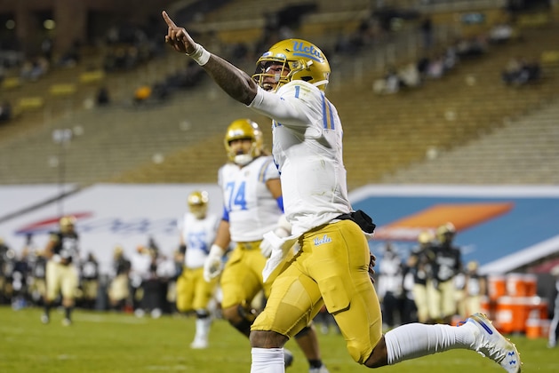 UCLA quarterback Dorian Thompson-Robinson celebrates after his long run for a touchdown in the second half of an NCAA college football game against Colorado, Saturday, Nov. 7, 2020, in Boulder, Colo. (AP Photo/David Zalubowski)