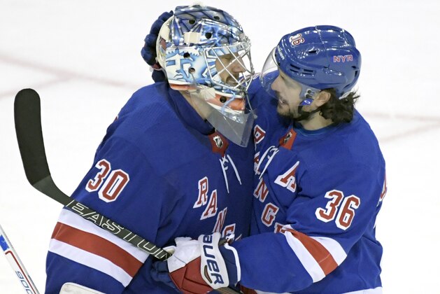 New York Rangers goalie Henrik Lundqvist (30) celebrates with Mats Zuccarello (36) after the Rangers defeated the Anaheim Ducks 4-1 in an NHL hockey game, Tuesday, Dec.19, 2017, at Madison Square Garden in New York. (AP Photo/Bill Kostroun)