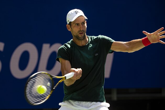 NEW YORK, NEW YORK - AUGUST 24: Novak Djokovic of Serbia practices with Casper Rudd of Norway before the start of the US Open at the USTA Billie Jean King National Tennis Center on August 24, 2021 in New York City. (Photo by TPN/Getty Images)