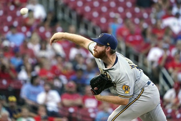 Milwaukee Brewers starting pitcher Brandon Woodruff throws during the first inning of a baseball game against the St. Louis Cardinals Thursday, Aug. 19, 2021, in St. Louis. (AP Photo/Jeff Roberson)