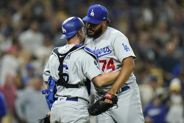 Los Angeles Dodgers relief pitcher Kenley Jansen, right, celebrates with catcher Will Smith after the Dodgers defeated the San Diego Padres 5-2 in a baseball game Tuesday, Aug. 24, 2021, in San Diego. (AP Photo/Gregory Bull)