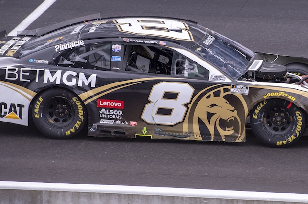 Tyler Reddick (8) leaves the pit area with heavy damage after being involved in an incident on the track during a NASCAR Cup Series auto race at Indianapolis Motor Speedway, Sunday, Aug. 15, 2021, in Indianapolis. (AP Photo/Doug McSchooler)