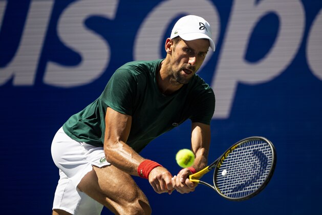NEW YORK, NEW YORK - AUGUST 24: Novak Djokovic of Serbia practices with Casper Rudd of Norway before the start of the US Open at the USTA Billie Jean King National Tennis Center on August 24, 2021 in New York City. (Photo by TPN/Getty Images)