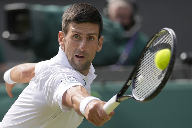 FILE - Serbia's Novak Djokovic plays a return to Italy's Matteo Berrettini during the men's singles final on day thirteen of the Wimbledon Tennis Championships in London, in this Sunday, July 11, 2021, file photo. Djokovic is seeded for the U.S. Open, the year's last Grand Slam tennis tournament. Play in the main draw begins in New York on Monday, Aug. 30. (AP Photo/Kirsty Wigglesworth, FIle)