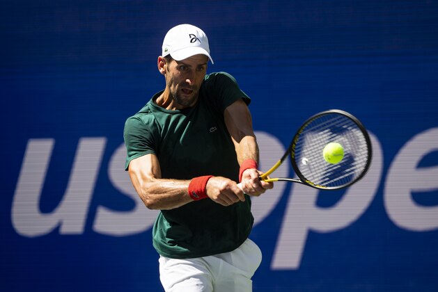 NEW YORK, NEW YORK - AUGUST 24: Novak Djokovic of Serbia practices with Casper Rudd of Norway before the start of the US Open at the USTA Billie Jean King National Tennis Center on August 24, 2021 in New York City. (Photo by TPN/Getty Images)