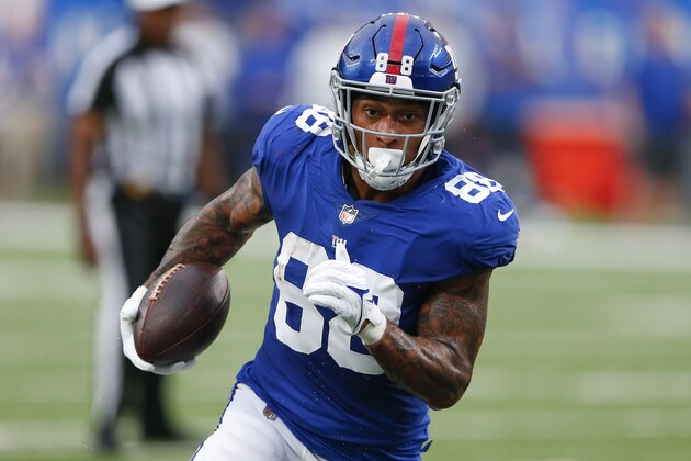 New York Giants tight end Evan Engram (88) runs for yards after catch during the first half of an NFL preseason football game against the New England Patriots Sunday, Aug. 29, 2021, in East Rutherford, N.J. (AP Photo/Noah K. Murray)