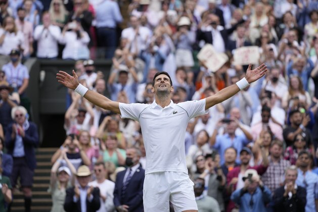 Serbia's Novak Djokovic celebrates after defeating Italy's Matteo Berrettini in the men's singles final on day thirteen of the Wimbledon Tennis Championships in London, Sunday, July 11, 2021. (AP Photo/Kirsty Wigglesworth)