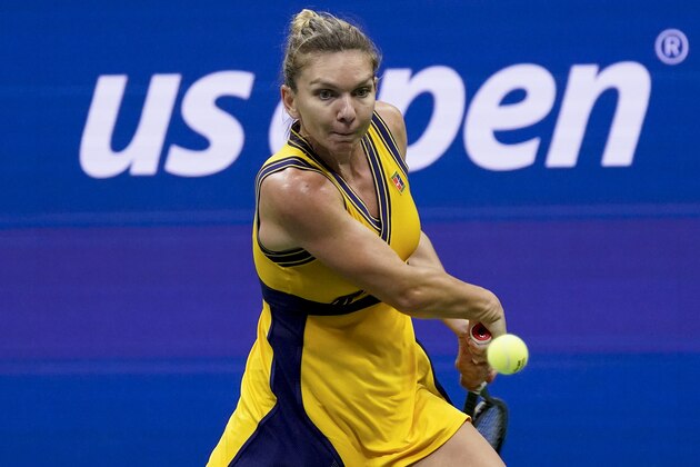 Simona Halep, of Romania, returns a shot to Kristina Kucova, of Slovakia, during the second round of the US Open tennis championships, Wednesday, Sept. 1, 2021, in New York. (AP Photo/Seth Wenig)