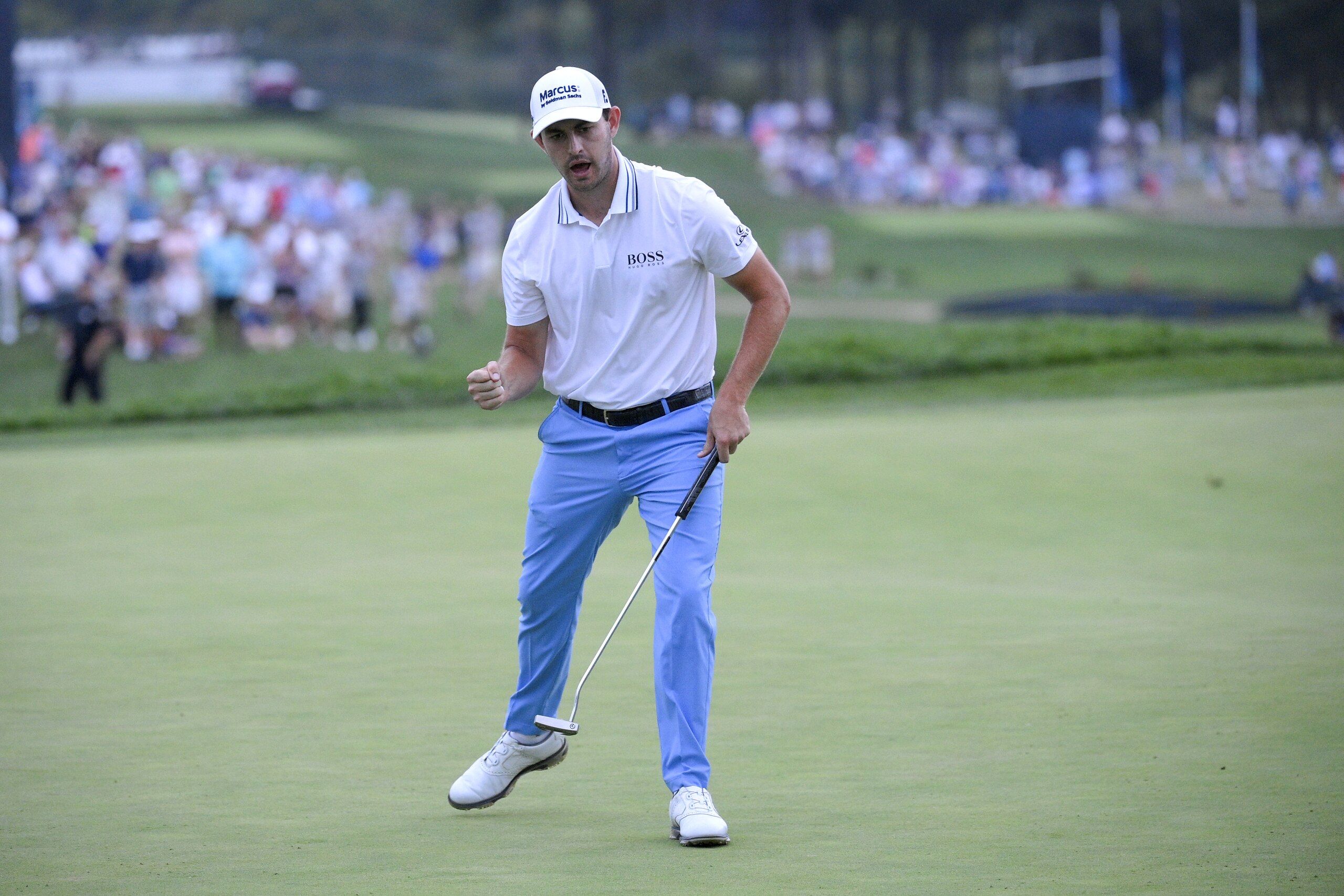 Patrick Cantlay reacts after sinking in his putt on the 18th green, the sixth playoff hole of the final round of the BMW Championship golf tournament, Sunday, Aug. 29, 2021, at Caves Valley Golf Club in Owings Mills, Md. (AP Photo/Nick Wass)