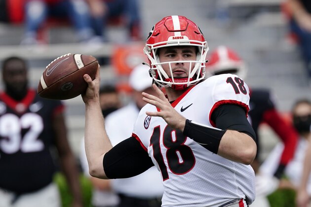 FILE - In this April 17, 2021, file photo, Georgia quarterback JT Daniels (18) throws a pass during their spring NCAA college football spring game in Athens, Ga. Daniels starred for a powerhouse team in high school. He launched his college career at one of the most storied programs in the nation. Yet none of that quite prepared this laid-back Californian for the passion that goes along with playing for the Georgia Bulldogs, for playing in the Southeastern Conference. (AP Photo/John Bazemore, File)