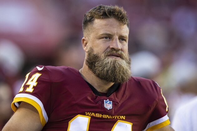 LANDOVER, MD - AUGUST 28: Ryan Fitzpatrick #14 of the Washington Football Team looks on while sitting out the preseason game against the Baltimore Ravens at FedExField on August 28, 2021 in Landover, Maryland. (Photo by Scott Taetsch/Getty Images)