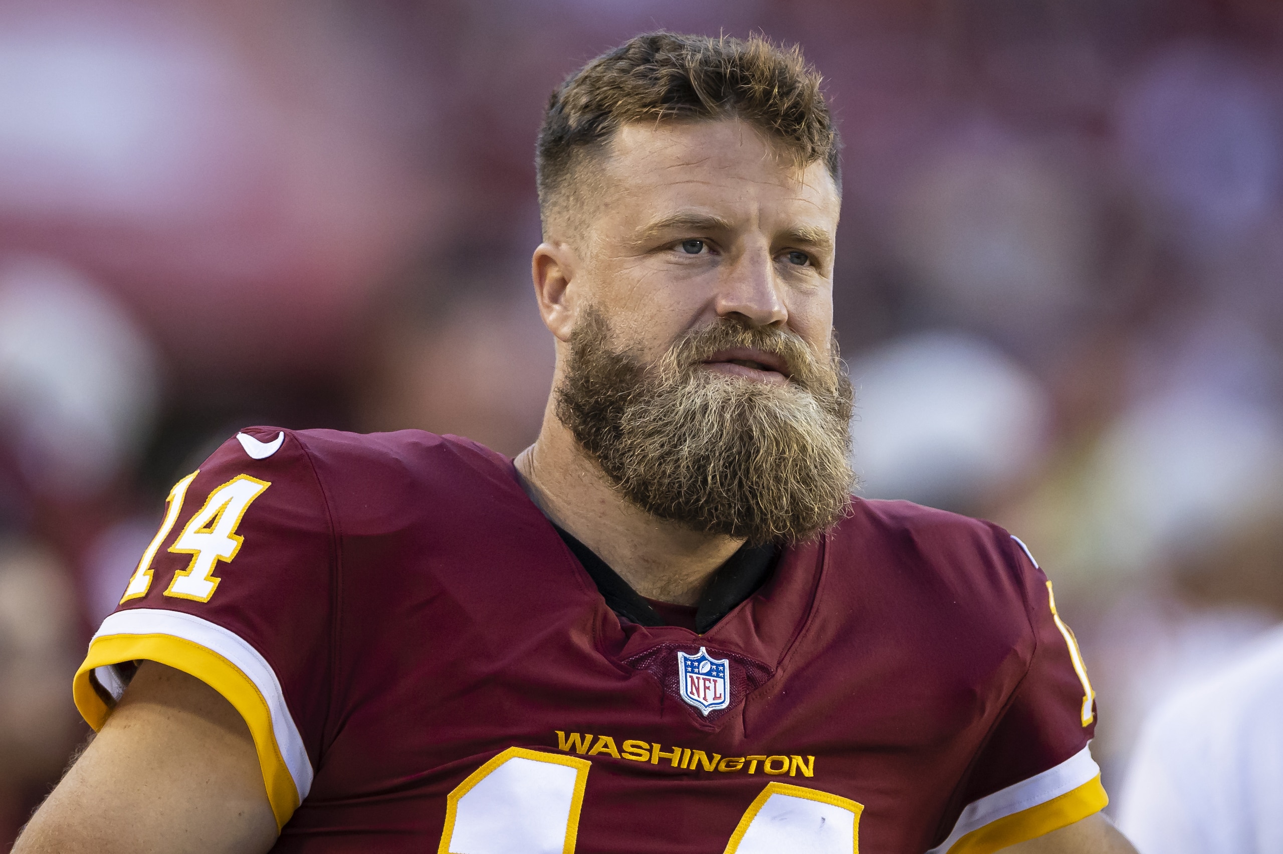 LANDOVER, MD - AUGUST 28: Ryan Fitzpatrick #14 of the Washington Football Team looks on while sitting out the preseason game against the Baltimore Ravens at FedExField on August 28, 2021 in Landover, Maryland. (Photo by Scott Taetsch/Getty Images)