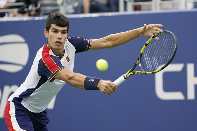 Carlos Alcaraz, of Spain, returns against Peter Gojowczyk, of Germany, during the fourth round of the U.S. Open tennis championships, Sunday, Sept. 5, 2021, in New York. (AP Photo/Frank Franklin II)