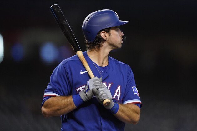 Texas Rangers' DJ Peters against the Arizona Diamondbacks during the first inning of a baseball game, Tuesday, Sept. 7, 2021, in Phoenix. (AP Photo/Matt York)