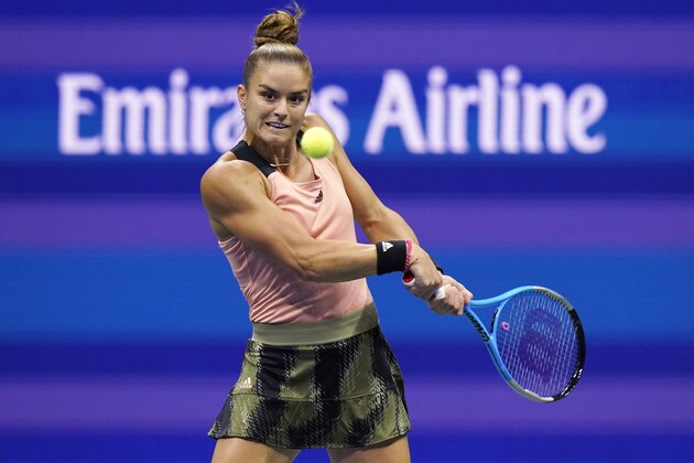 Maria Sakkari, of Greece, eyes the ball before hitting a return to Karolina Pliskova, of the Czech Republic, during the quarterfinals of the U.S. Open tennis tournament Wednesday, Sept. 8, 2021, in New York. (AP Photo/Frank Franklin II)