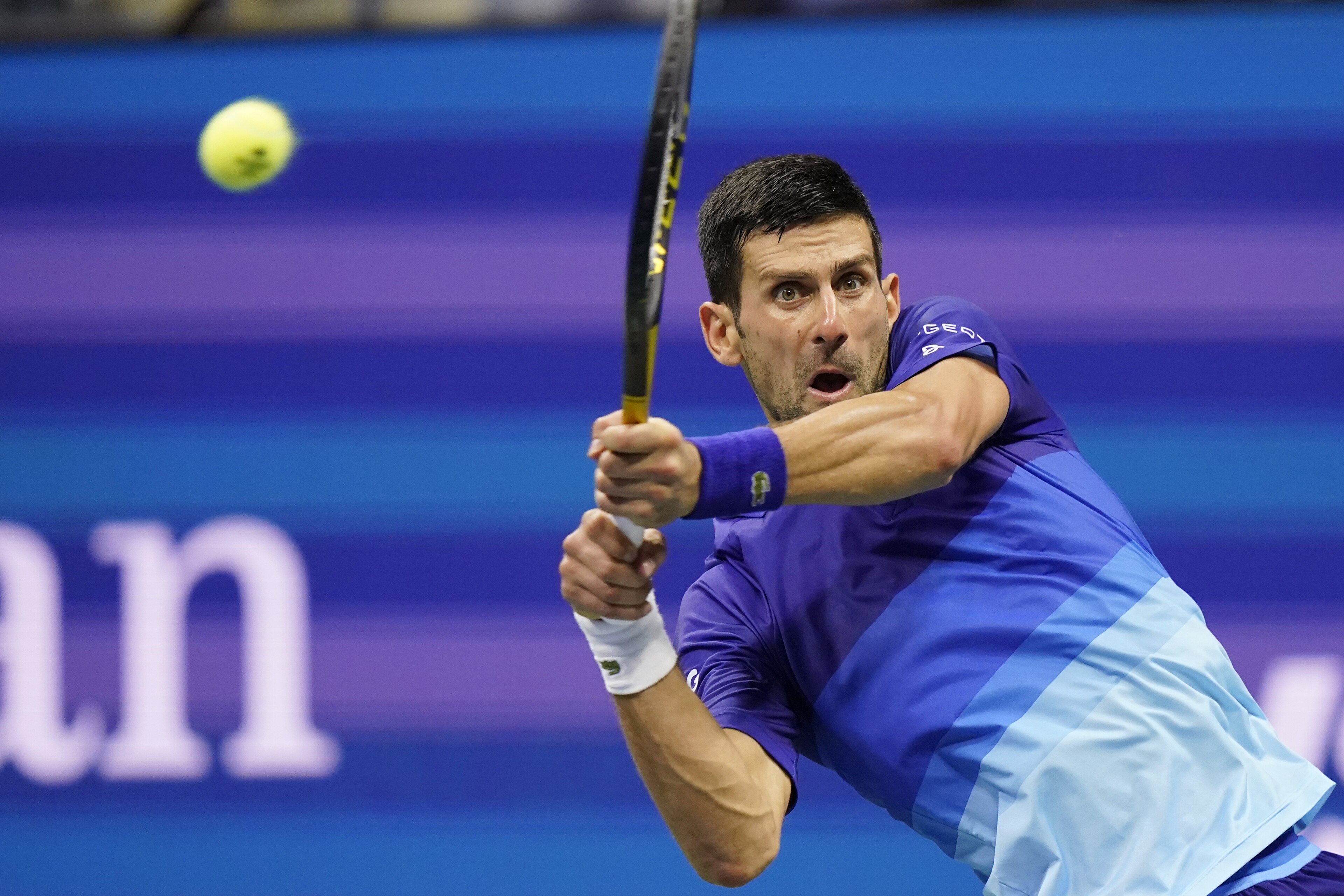 Novak Djokovic, of Serbia, hits a backhand to Matteo Berrettini, of Italy, during the quarterfinals of the U.S. Open tennis tournament Wednesday, Sept. 8, 2021, in New York. (AP Photo/Frank Franklin II)