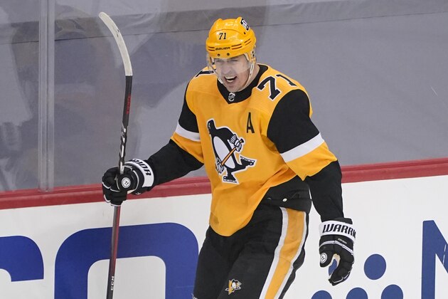 Pittsburgh Penguins' Evgeni Malkin (71) celebrates his goal during the first period in Game 5 of an NHL hockey Stanley Cup first-round playoff series against the New York Islanders n Pittsburgh, Monday, May 24, 2021. (AP Photo/Gene J. Puskar)