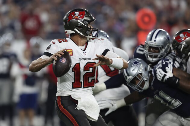 Tampa Bay Buccaneers quarterback Tom Brady (12) looks to pass against the Dallas Cowboys during the first half of an NFL football game Thursday, Sept. 9, 2021, in Tampa, Fla. (AP Photo/Mark LoMoglio)