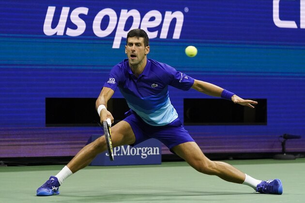 Novak Djokovic, of Serbia, returns a shot to Alexander Zverev, of Germany, during the semifinals of the US Open tennis championships, Friday, Sept. 10, 2021, in New York. (AP Photo/Elise Amendola)
