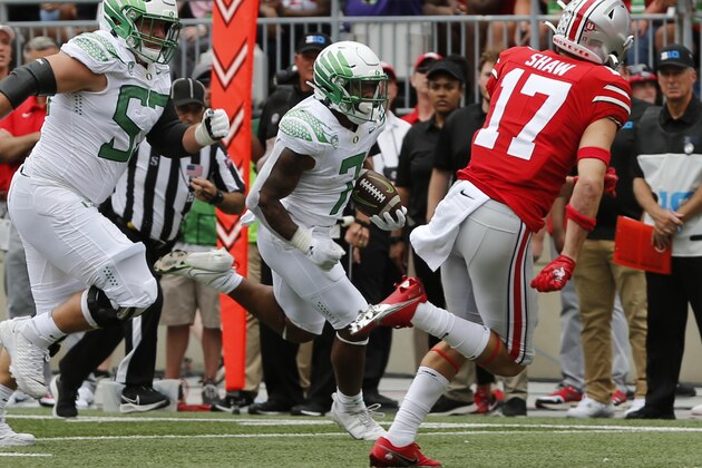 Oregon running back CJ Verdell, center, scores a touchdown against Ohio State during the first half of an NCAA college football game Saturday, Sept. 11, 2021, in Columbus, Ohio. (AP Photo/Jay LaPrete) Oregon running back CJ Verdell, center, scores a touchdown against Ohio State during the first half of an NCAA college football game Saturday, Sept. 11, 2021, in Columbus, Ohio. (AP Photo/Jay LaPrete)