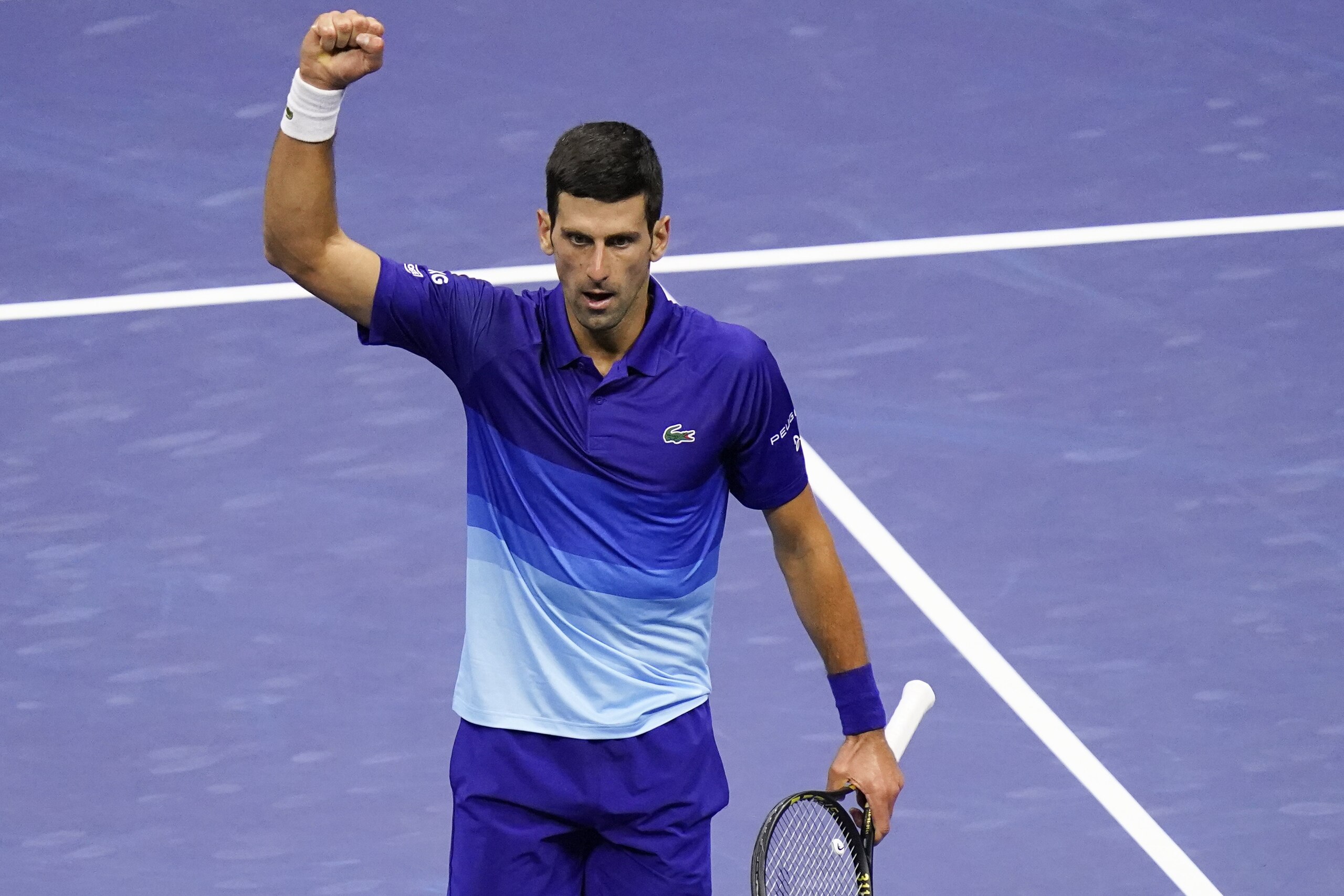 Novak Djokovic, of Serbia, reacts after winning the third set against Alexander Zverev, of Germany, during the semifinals of the US Open tennis championships, Friday, Sept. 10, 2021, in New York. (AP Photo/Seth Wenig)