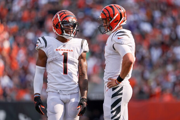 CINCINNATI, OHIO - SEPTEMBER 12: Ja'Marr Chase #1 and Joe Burrow #9 of the Cincinnati Bengals meet in overtime against the Minnesota Vikings at Paul Brown Stadium on September 12, 2021 in Cincinnati, Ohio. (Photo by Dylan Buell/Getty Images)