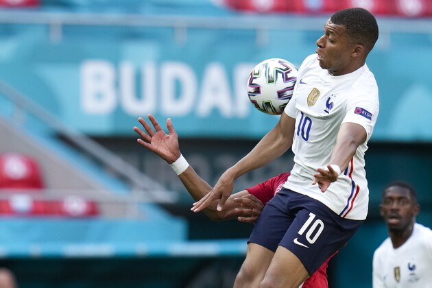 France's Kylian Mbappe goes for the ball during the Euro 2020 soccer championship group F match between Hungary and France, at the Ferenc Puskas stadium in Budapest, Saturday, June 19, 2021. (AP Photo/Darko Bandic, Pool)