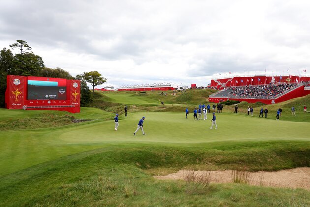 KOHLER, WISCONSIN - SEPTEMBER 21: Tyrrell Hatton of England and team Europe, Tommy Fleetwood of England and team Europe, Jon Rahm of Spain and team Europe and Shane Lowry of Ireland and team Europe putt on the 18th green during a practice round prior to the 43rd Ryder Cup at Whistling Straits on September 21, 2021 in Kohler, Wisconsin. (Photo by Richard Heathcote/Getty Images)
