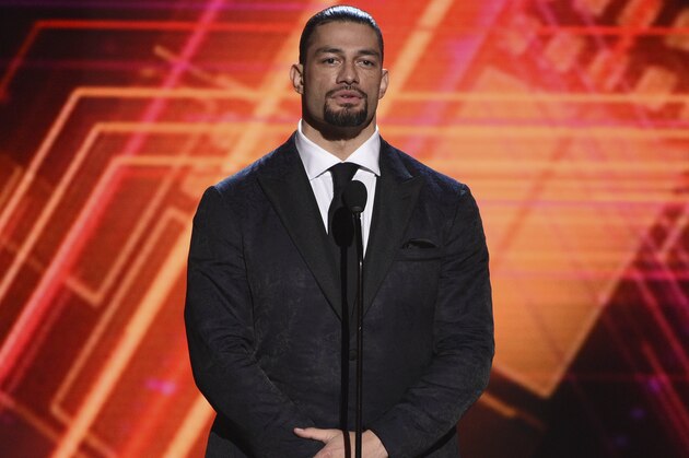 Roman Reigns presents the best coach award at the ESPY Awards on Wednesday, July 10, 2019, at the Microsoft Theater in Los Angeles. (Photo by Chris Pizzello/Invision/AP)