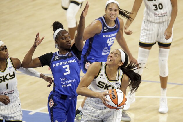 Connecticut Sun's Kaila Charles (3) tries to stop Chicago Sky's Candace Parker (3) from scoring during a WNBA basketball game Saturday, June 19, 2021, in Chicago. (AP Photo/Eileen T. Meslar) Connecticut Sun's Kaila Charles (3) tries to stop Chicago Sky's Candace Parker (3) from scoring during a WNBA basketball game Saturday, June 19, 2021, in Chicago. (AP Photo/Eileen T. Meslar)