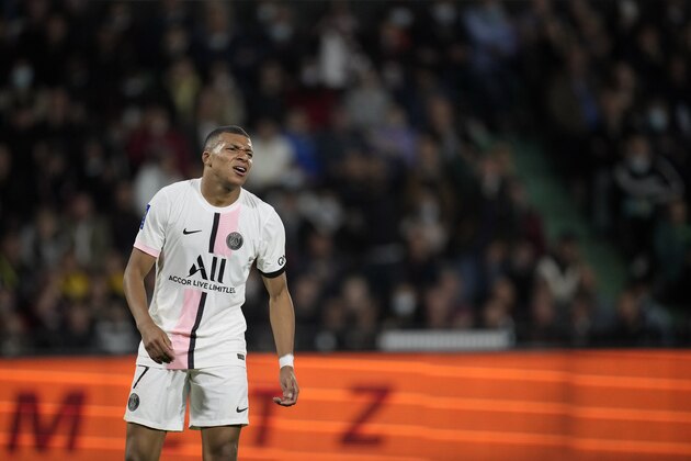 PSG's Kylian Mbappe grimaces after missing a chance during the French League One soccer match between FC Metz and Paris Saint-Germain at Saint Symphorien stadium, in Metz, eastern France, Wednesday, Sept. 22, 2021. (AP Photo/Christophe Ena)