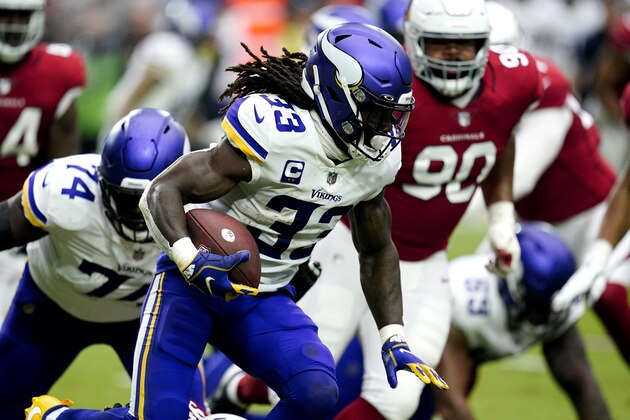 Minnesota Vikings running back Dalvin Cook (33) runs the ball against the Arizona Cardinals during the first half of an NFL football game, Sunday, Sept. 19, 2021, in Glendale, Ariz. (AP Photo/Ross D. Franklin)