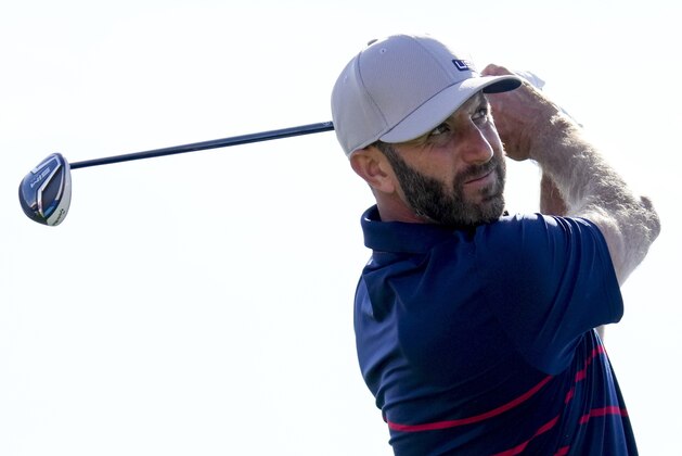 Team USA's Dustin Johnson hits on the 11th hole during a four-ball match the Ryder Cup at the Whistling Straits Golf Course Friday, Sept. 24, 2021, in Sheboygan, Wis. (AP Photo/Ashley Landis)