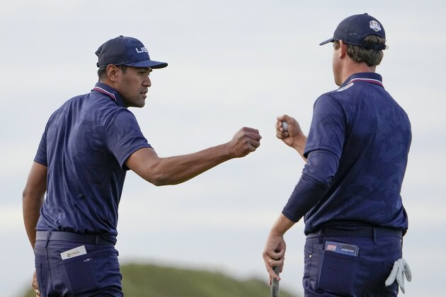 Team USA's Tony Finau reacts after making a putt on the 16th hole during a four-ball match the Ryder Cup at the Whistling Straits Golf Course Saturday, Sept. 25, 2021, in Sheboygan, Wis. (AP Photo/Jeff Roberson)