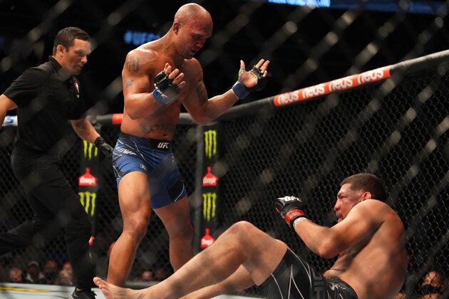 LAS VEGAS, NEVADA - SEPTEMBER 25: (L-R) Robbie Lawler reacts to Nick Diaz during the UFC 266 event on September 25, 2021 in Las Vegas, Nevada. (Photo by Cooper Neill/Zuffa LLC)