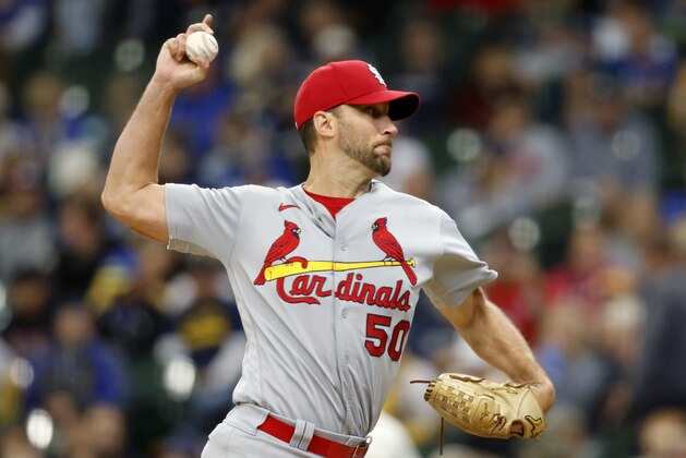 St. Louis Cardinals starting pitcher Adam Wainwright strikes out Milwaukee Brewers' Luis Urias for his career 2,000th strikeout during the fourth inning of a baseball game Thursday, Sept. 23, 2021, in Milwaukee. (AP Photo/Jeffrey Phelps)