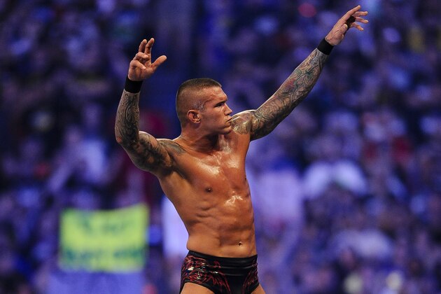 FILE- In this Sunday, April 3, 2011 file photo, WWE Superstar Randy Orton celebrates defeating CM Punk (not pictured) during WrestleMania XXVII at the Georgia Dome in Atlanta, Georgia on. World-famous WWE wrestlers such as John Cena, Shaemus and champion Randy Orton are in Saudi Arabia for three days of matches in the capital Riyadh. (Paul Abell/AP Images for WWE, File)