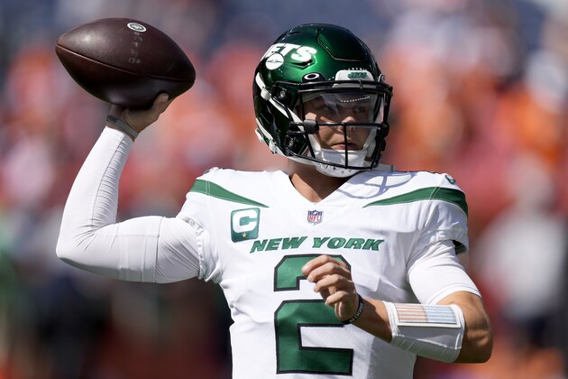 New York Jets quarterback Zach Wilson (2) warms up prior to an NFL football game against the Denver Broncos, Sunday, Sept. 26, 2021, in Denver. (AP Photo/David Zalubowski)