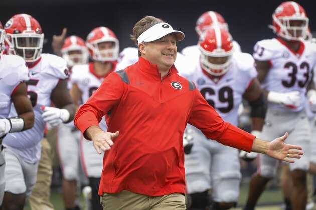 Georgia coach Kirby Smart comes onto the field before an NCAA college football game against Vanderbilt on Saturday, Sept. 25, 2021, in Nashville, Tenn. (AP Photo/John Amis)