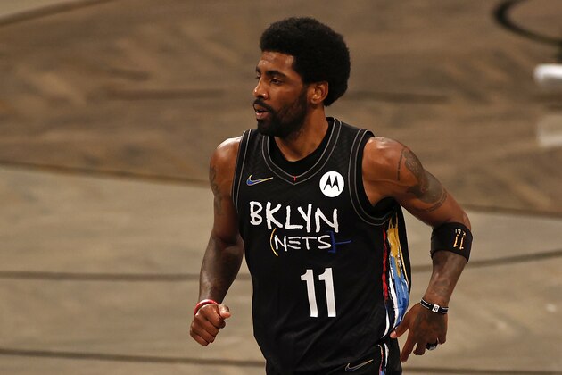 Brooklyn Nets guard Kyrie Irving (11) reacts against the Boston Celtics in the first half of Game 5 during an NBA basketball first-round playoff series, Tuesday, June 1, 2021, in New York. (AP Photo/Adam Hunger)