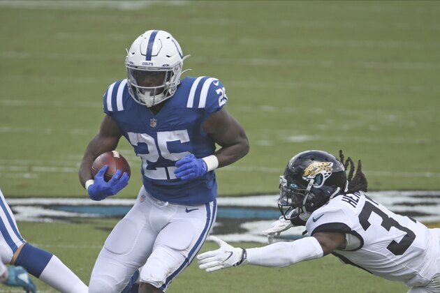 Indianapolis Colts running back Marlon Mack (25) looks for room during the first half of an NFL football game, Sunday, Sept. 13, 2020, in Jacksonville, Fla. (AP Photo/Stephen B. Morton)