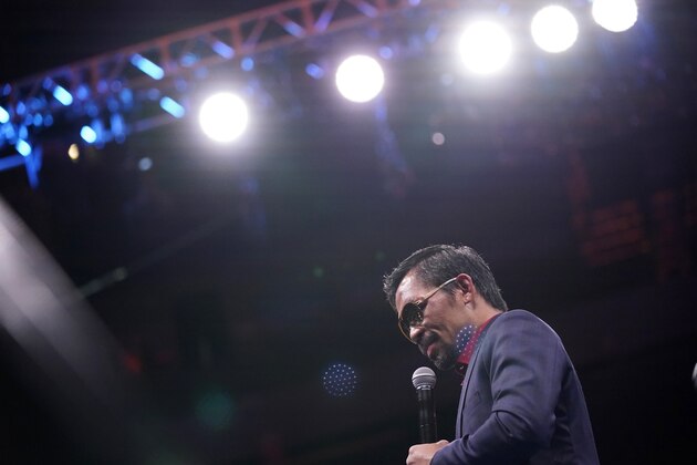 Manny Pacquiao, of the Philippines, speaks at a news conference after his loss to Yordenis Ugas, of Cuba, in a welterweight championship boxing match Saturday, Aug. 21, 2021, in Las Vegas. (AP Photo/John Locher)