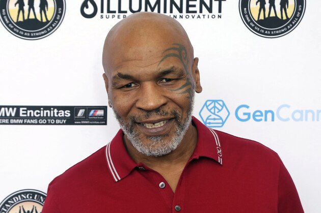 FILE - In this Aug. 2, 2019, file photo, Mike Tyson attends a celebrity golf tournament in Dana Point, Calif. Tyson and Roy Jones Jr. are older, wiser, calmer men than the superstars who dominated their sport. Their fight at Staples Center on Saturday night, Nov. 28, is an eight-round exhibition bout with no official judging and limited violence, although the limit depends on whether you're asking the fighters or the California State Athletic Commission. For Tyson and Jones, this unique pay-per-view boxing match is less of a sporting event and more of a chance for two transcendent athletes to prove age is a number and aging is a choice. (Photo by Willy Sanjuan/Invision/AP, File)
